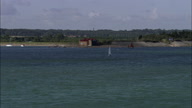 Low Shot Along Sea And Coast With Sail Boats