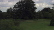 Burghley Park Trees Followed By Reveal Of Burghley House