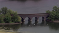 Steam Train Passing Over Lake On Bridge - Swans Beneath