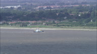 Focus On Small Boat Then Descend-Reveal Past Humber Suspension Bridge In C/U