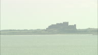 Holy Island Castle With Pull Back From Bamburgh