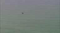 Low Flying Helicopter Across The Sea