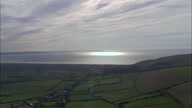 Back Lit Hills Leading To Coast And Bideford Bar