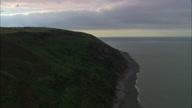 Exmoor Coastline With Forest Down To Shoreline