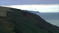 Exmoor Coastline With Forest Down To Shoreline