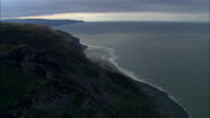 Exmoor Coastline With Forest Down To Shoreline