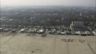 Low Over Beach And Seaside At Milano Marittima Passing Its Marina With Boats