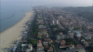 Roseto Degli Abruzzi With Pier In Background And Railway Near Seaside With Freight Train Passing