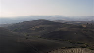 Landscape Of Hills And Sparse Trees Between Abruzzo And Puglia  Apulia  With Electric Pylons