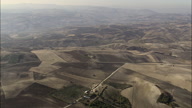 Landscape Of Hills And Sparse Trees Between Abruzzo And Puglia  Apulia  With Electric Pylons