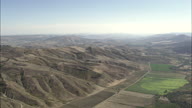 Pan Left To Reveal Irsina Wide In Fertile Valley Of Bradano River In Basilicata With Hills In Background