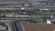 Wide Of Doric Greek Temple At Metaponto With Provincial Road And Cars In The Foreground  Temple Of Hera