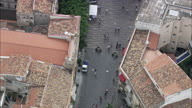 Directly Down People Stroll On Main Streets Of Cefalu