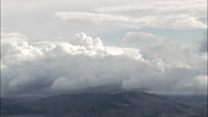 Fluffy Clouds Over Sicilian Mountains