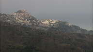 Long Shot Of Taormina Perched On Hills