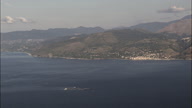 Industrial Fishing Farm  Circles  At Sea With Coast In The Background