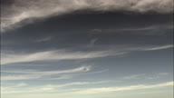 Wispy Cirrus Clouds In Blue Sky Near Ischia Island