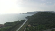 Low Towards Talamone At The Mouth Of Osa River Flying Over Old Lighthouse On Promontory