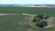 Following A Tractor On A Dirt Road