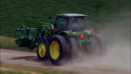 Following A Tractor On A Dirt Road
