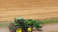 Following A Tractor On A Dirt Road