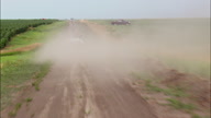 Pickups On Dirt Road