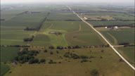 Long Straight Dirt Road And Farms