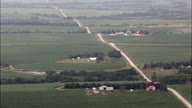 Long Straight Dirt Road And Farms