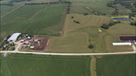 Long Straight Dirt Road And Farms