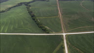 Long Straight Dirt Road And Farms