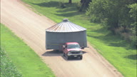 Pickup Pulling Round Grain Store