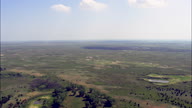 Flight Over Sandhills And Tree Line